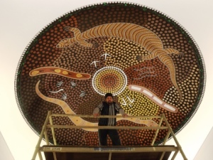 Kalgoorlie artist Jason Dimer with his completed artwork. Image courtesy of Jeanette Dimer.
