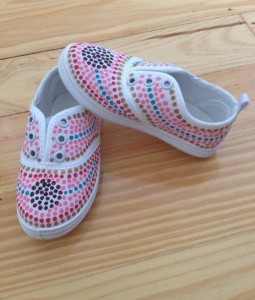 A pair of baby shoes designed by Kylie-Lee Bradford for Kakadu Tiny Tots.