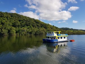 A large boat on the river on a sunny day,